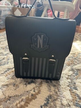 Black Leather-Style Women’s Backpack with Crest Accent